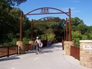Riding a bike through a park