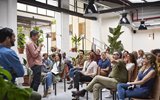 A person presenting to a group of people