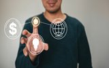 Man selecting icons of money, light bulb, globe